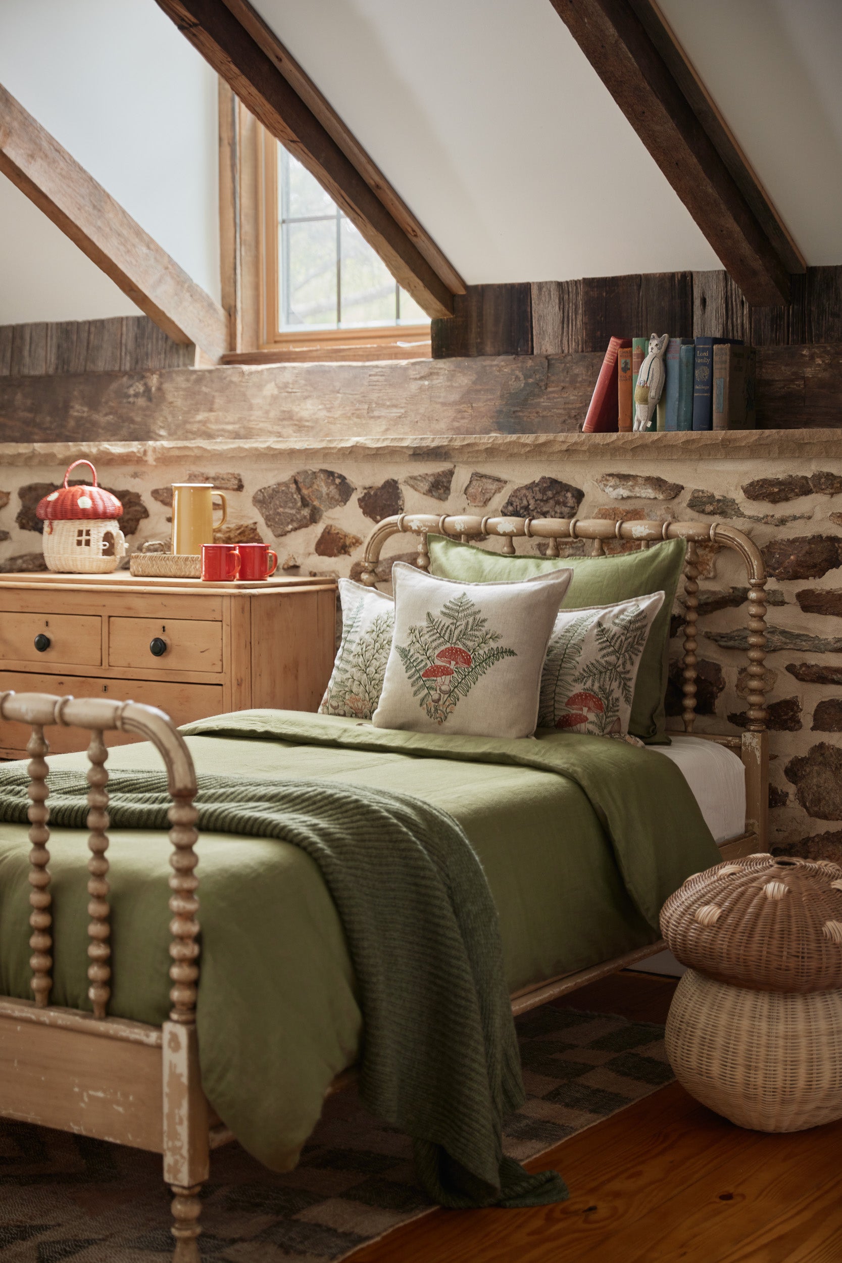 Coral & Tusk pillows styled on a twin bed in cottagecore style
