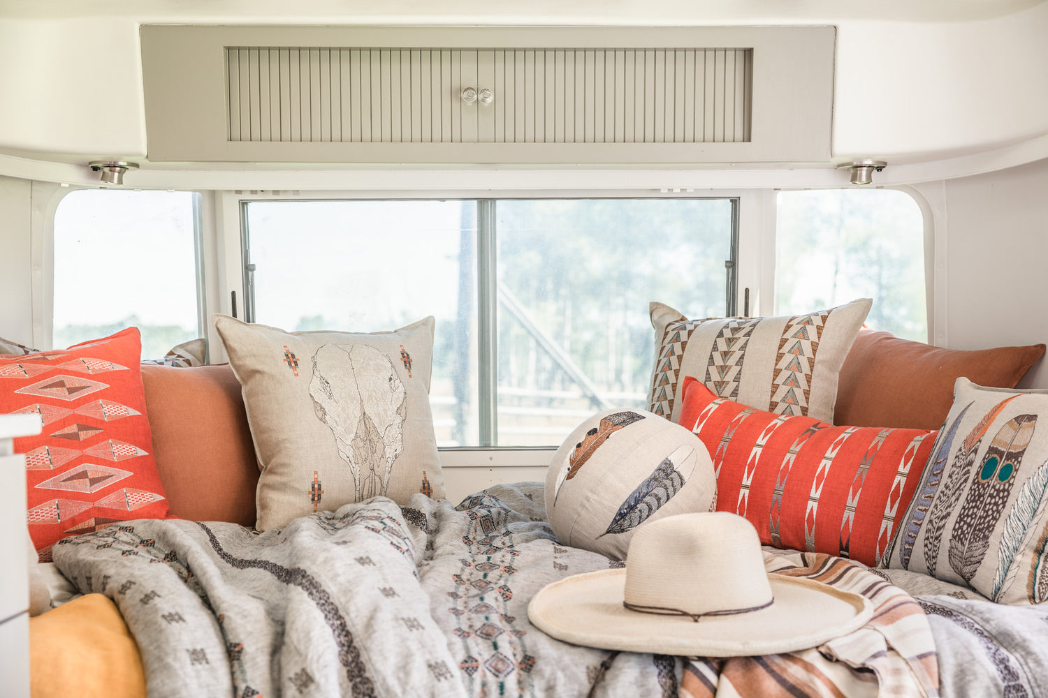 Coral & Tusk pillows inside an Airstream