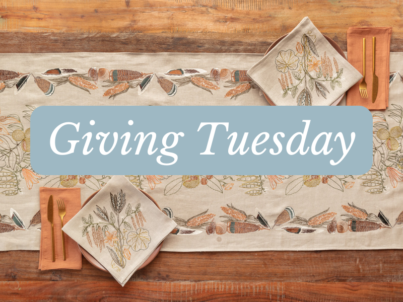 Giving Tuesday banner over a Coral & Tusk table runner