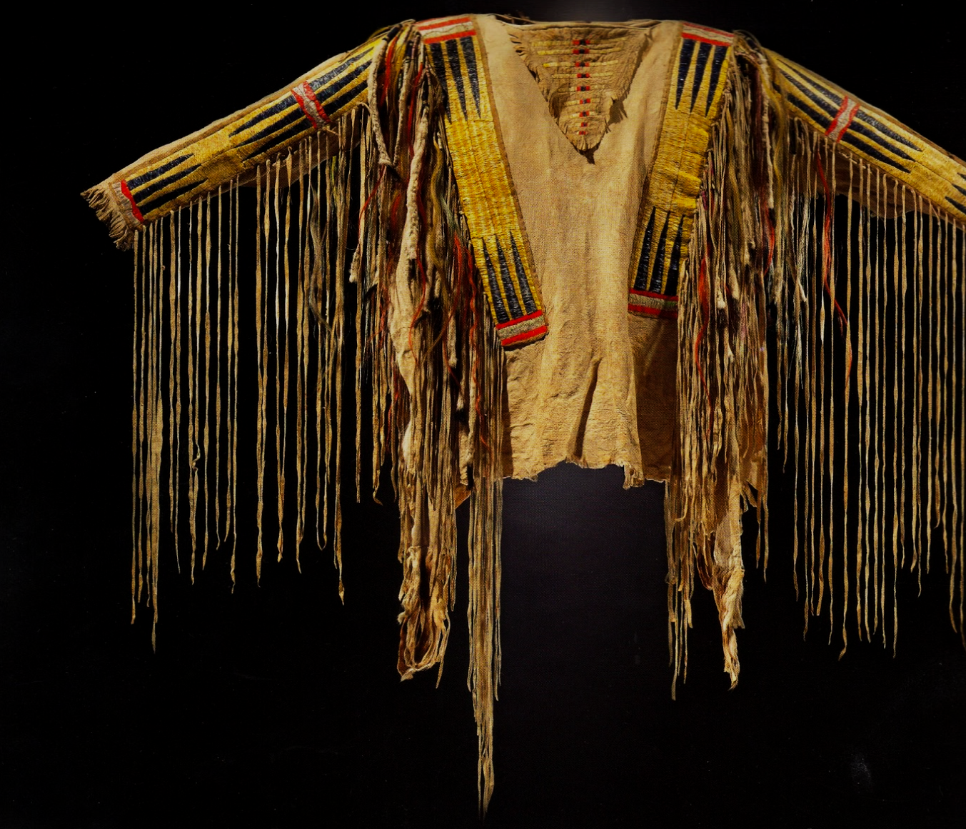 Photo of a shirt dating back to 1875 from the Hidatsa tribe in North Dakota. Created from leather, wool cloth, ermine and horsehair.