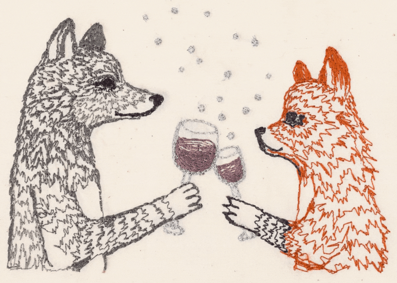 Gif of an embroidered wolf and fox cheers-ing