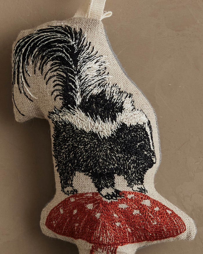 Skunk with Mushroom Ornament