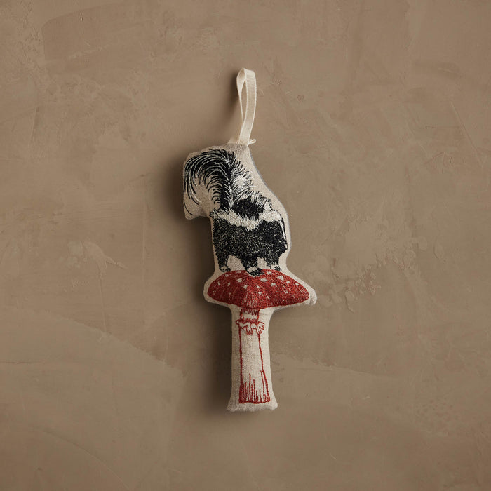 Skunk with Mushroom Ornament