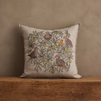 Coral & Tusk Partridge in a Pear Tree Pillow, 20 × 20-inch embroidered linen, featuring pear branches, leaves, and partridges with a baby chick in earthy gray, rust, and olive tones.