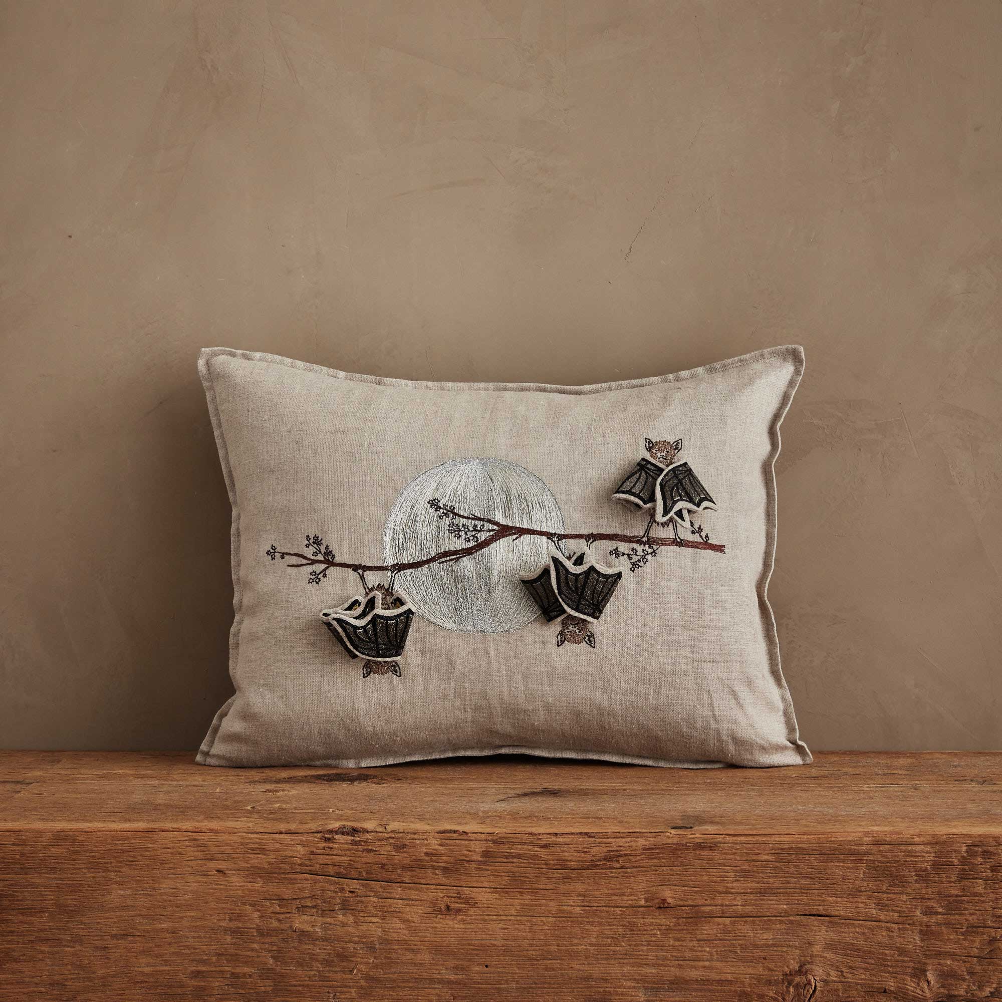 Coral & Tusk 12 × 16 inch embroidered linen Bat Branch Pillow featuring three bats hanging from a branch against a full moon.