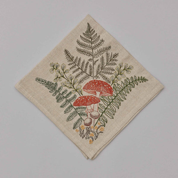 https://coralandtusk.com/cdn/shop/files/coralandtusk_dinner_napkin_mushrooms_ferns_1_grande.jpg?v=1687295727