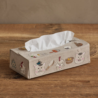 Coral & Tusk Nekomura san Collaboration embroidered linen tissue box cover on wood surface.  