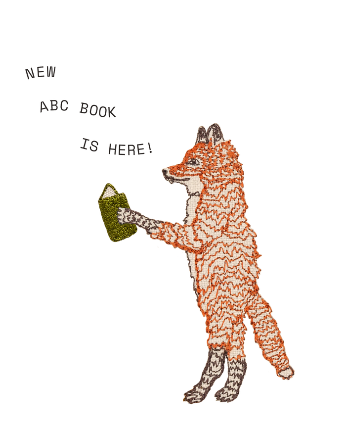 Coral & Tusk embroidered illustration of a fox holding a book with text 